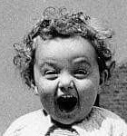 Original: a laughing toddler with curly hair